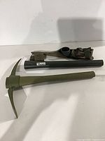 Assembled pick and disassembled pick components with pouch laid out