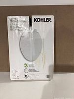 Front of sealed Kohler Layne toilet seat box showing product name and image
