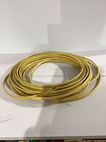 Full view of coiled yellow 12/2 wire