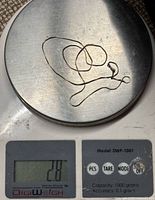 Gold chain on scale showing 2.8 g