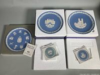 All three Wedgwood plates with their boxes and pamphlets