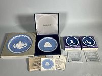 Overall lot showing four plates with boxes and paperwork