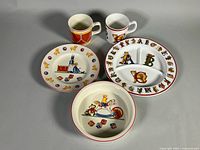 Five Tiffany Toys dish pieces displayed