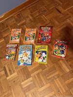 Seven Pokémon paperback books laid out on floor showing front covers