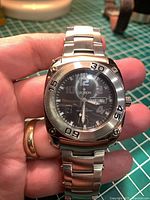 Front view of Croton diver watch showing dial, bezel, bracelet