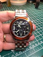 Front view of Emporio Armani AR-0552 watch showing dial, bezel and bracelet