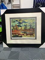 Framed lithograph front view showing black frame, ivory mat, artwork