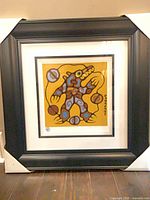 Framed Medicine Bear giclée print in black frame with double mat