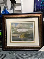 Full view of framed lithograph showing image, matting and ornate frame