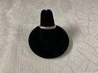 Ring on black display showing band profile