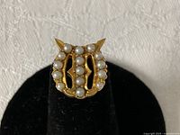 Front view showing gold form and seed pearl rows