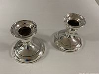 Both Birks sterling silver candle holders top view