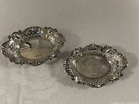 Pair of oval pierced sterling dishes top view