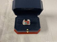 Front view of sterling silver ring in Jubilee box showing four-stone inlay