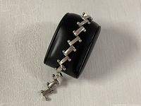 Bracelet displayed on jewelry stand showing link pattern