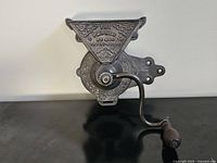 Front view of C Parker Co. No 460 cast iron wall-mount coffee grinder showing overall form