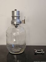 Full view of glass dispenser and separate wall bracket