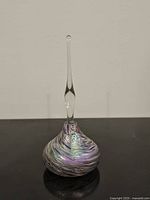 Full view of iridescent art glass perfume bottle with stopper
