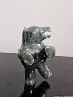 Front view of polished soapstone dancing bear sculpture
