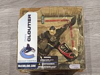 Front view of sealed Dan Cloutier McFarlane Toys action figure in packaging