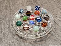 Top view of all marbles arranged on glass board