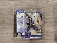 Front view showing Al MacInnis figure, packaging graphics, NHL Series 7 label