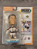 Front of sealed Patrick Roy Playmakers figurine package