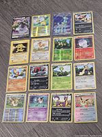 Overall view showing all 16 Pokémon cards laid out
