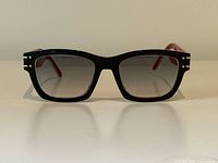 Front view of frames showing shape, gradient lenses and front rivets