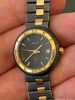 Front view of watch showing dial, bezel, bracelet detail