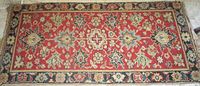 Full view of entire oriental rug showing pattern and colours