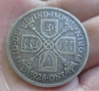 Reverse showing 1928 date, ONE FLORIN denomination, cruciform shields design