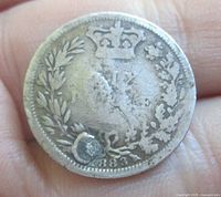 Reverse of 1883 sixpence showing crown, wreath and date