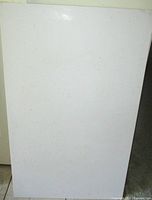 Front view of full white Corian dough board