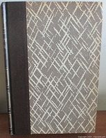Front cover showing cloth spine and patterned boards