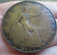 Face showing seated Britannia with 'ONE PENNY' legend and 1921 date
