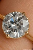 Close-up of diamond and prongs on 10K gold band