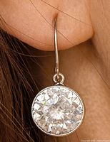 Earring worn in ear showing size and drop style