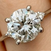 close-up of round center diamond in six-prong setting