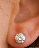 Diamond stud earring worn in ear