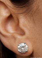 Stud earring worn on ear to show size and appearance