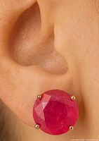 Earring worn on ear showing size and setting