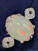 Top view showing opal cabochon and CZ shoulders