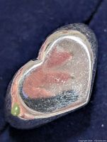 Heart-shaped silver ring close-up front