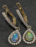 front view of both earrings showing opal and CZ halo