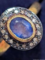 Top view showing sapphire, diamond halo, bezel, and band