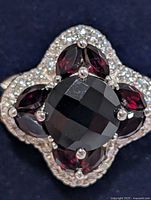 Top view showing garnet centre, marquise garnets and CZ halo