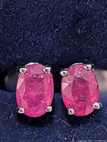 front view showing ruby faces and prong settings