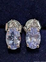 Front view showing both oval tanzanite stones and accent stones