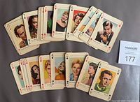 Fronts of 25 movie star playing cards spread out